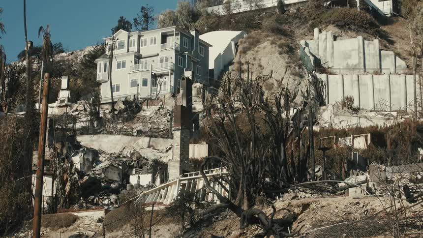 A home is completely burned down on the hill