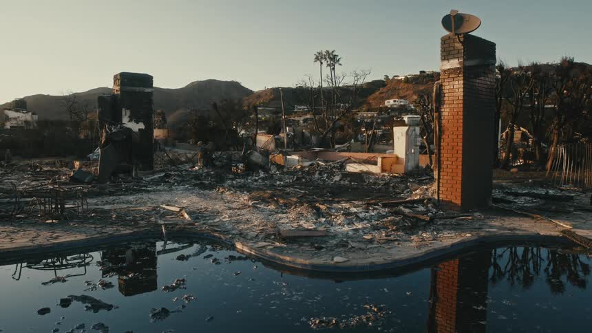 The home is completely burned down leaving only the chimney