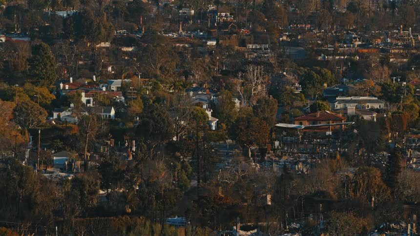 Panoramic view of a residential area with houses surrounded by trees