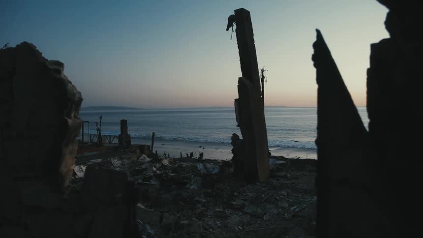 The home is completely burned down on the beach