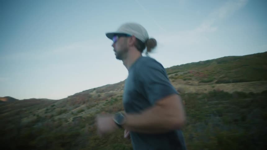 A man runs out into the distance on the road