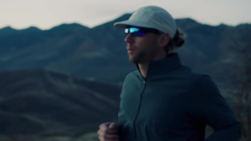 A man is taking a morning jog through the mountains
