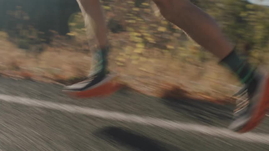 Man in cap running outdoors during daytime