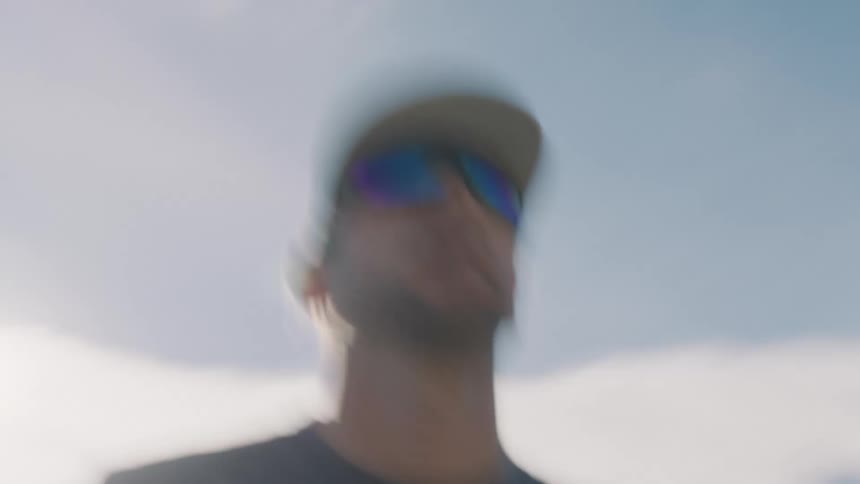 A man is standing on the side of the road
