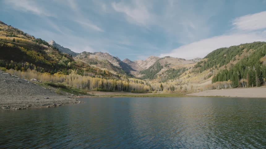 A lake is near the mountain pass