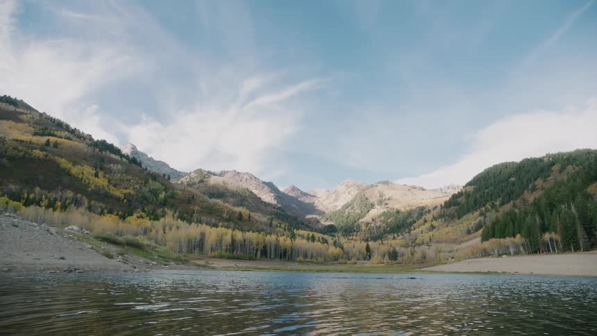 A person is swimming to the shore of the lake