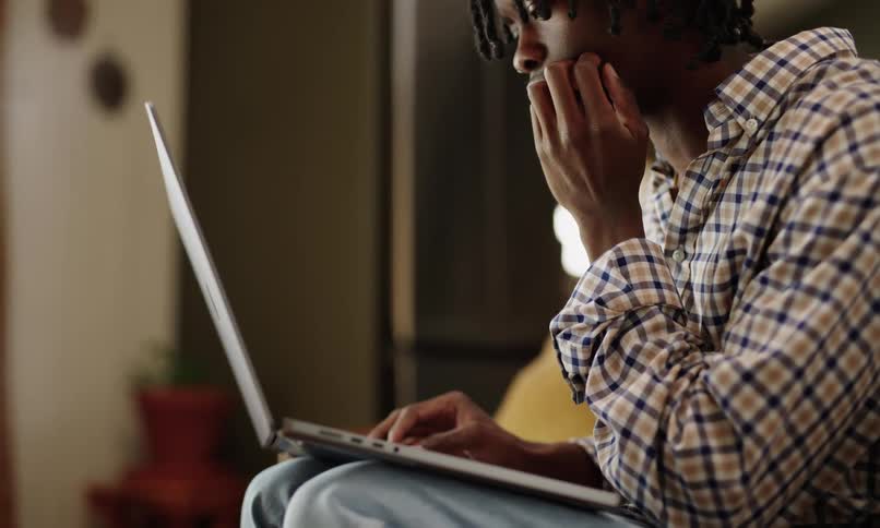 A close up clip of a person operating a laptop