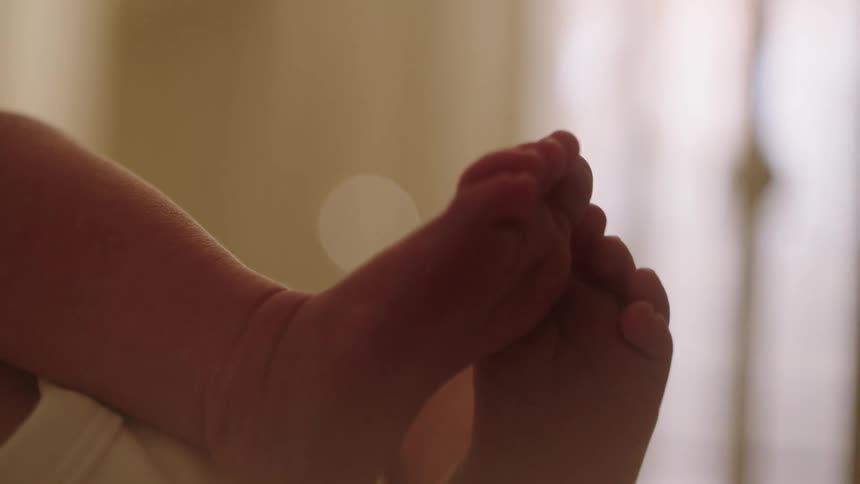 Close up of a babys legs in motion