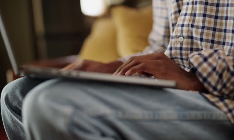 A clip of a person operating a laptop