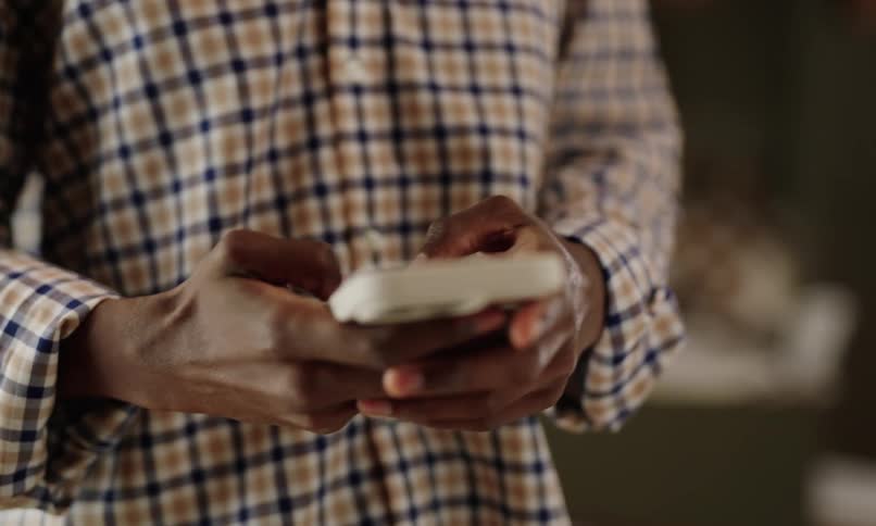 A clip of a man operating a smartphone