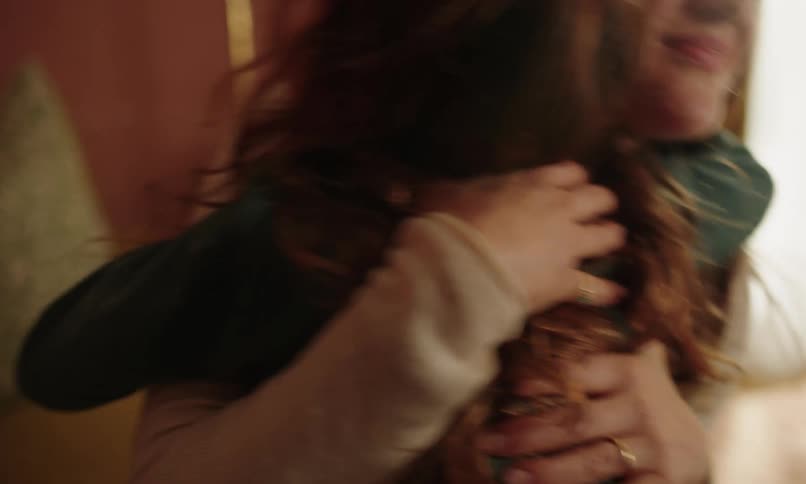 Mother opening her arms and lovingly hugging her daughter