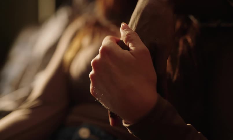Woman caressing her partners hands