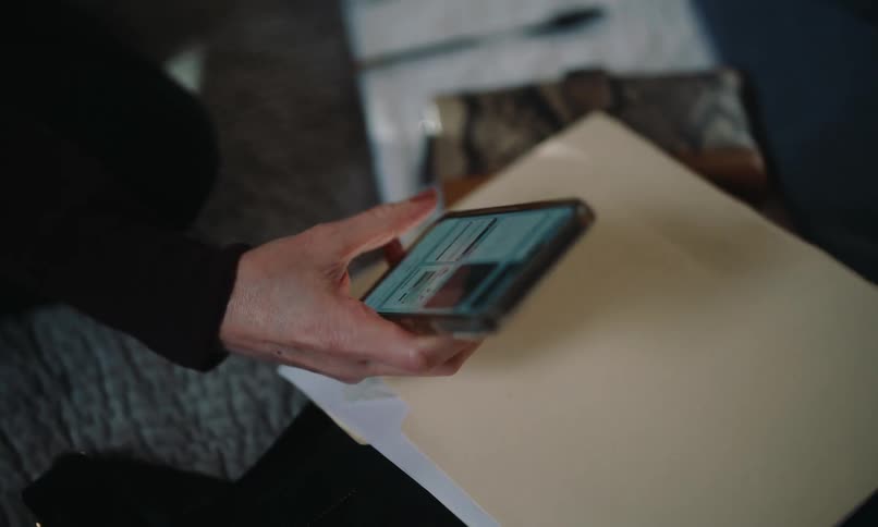 Close up of a hand interacting with a smartphone
