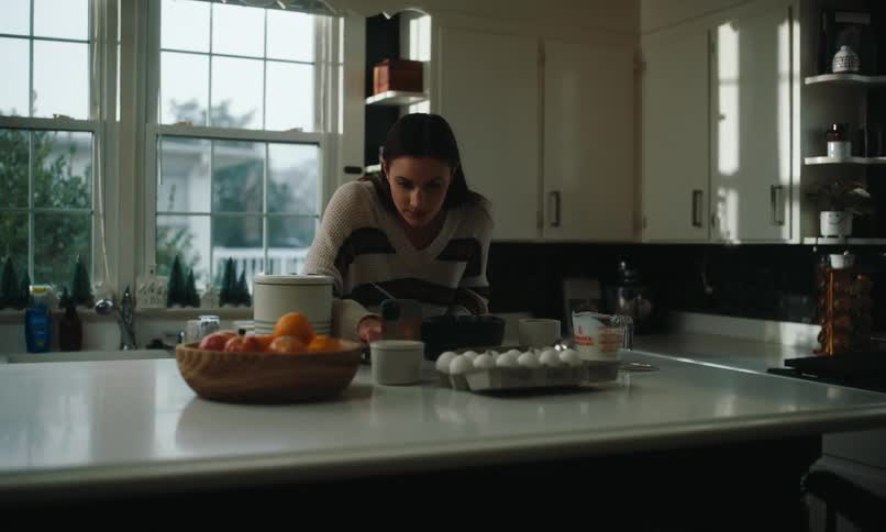 Woman using eggs and cooking in the kitchen