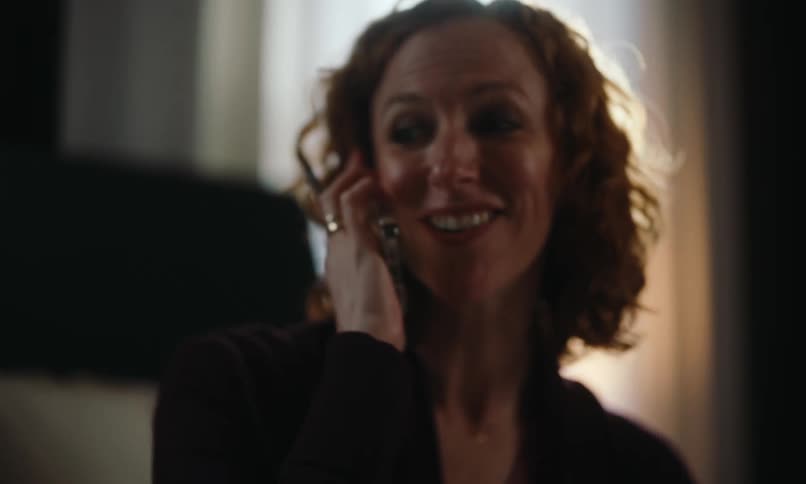 A clip of a lady on a phone call