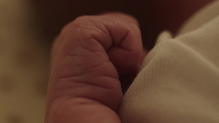 Closeup of a baby making a fist