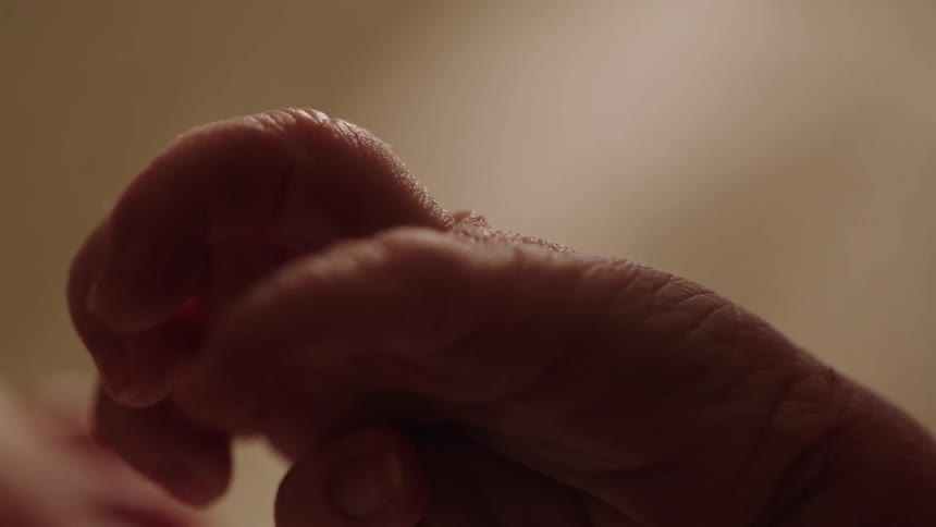 Closeup shows a babys closed hand