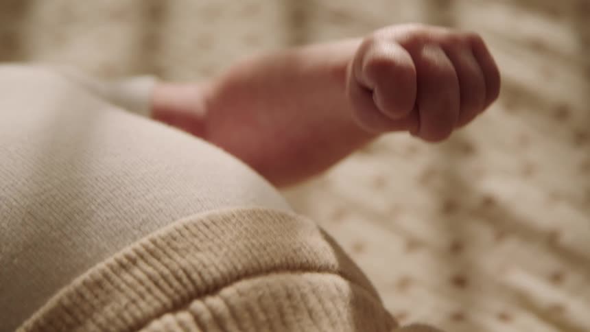 Closeup of a babys hand moving