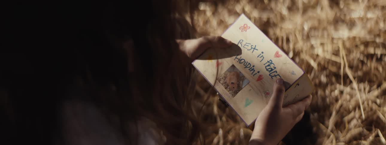Pair of girls hands holding a white box