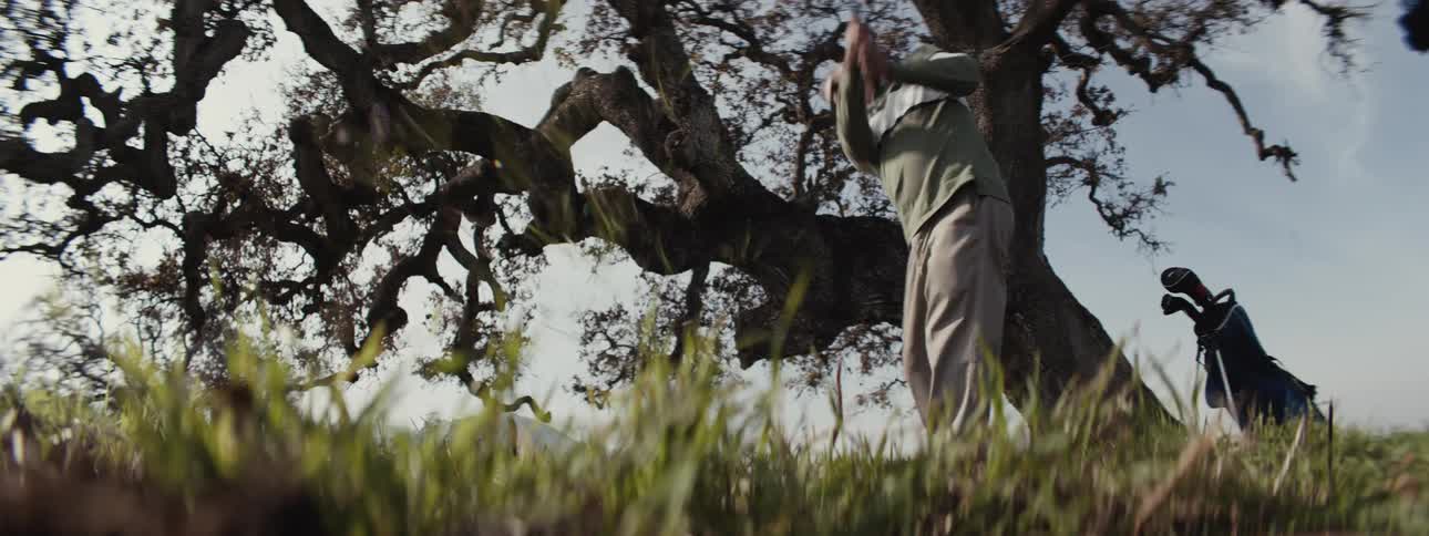 A footage of a person paying golf