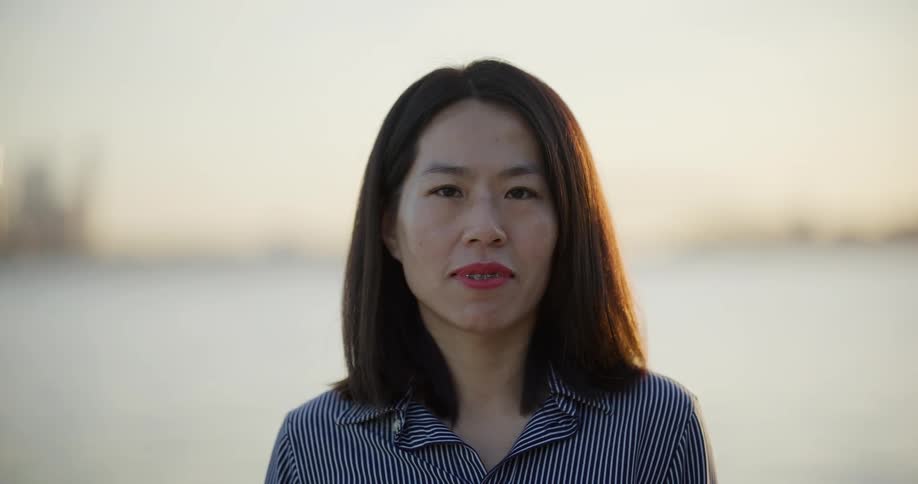 Portrait of a woman against a background of a blurred sea