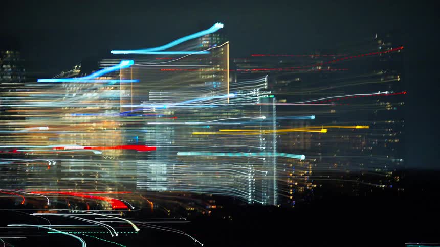 Illuminated buildings at night in a metropolis