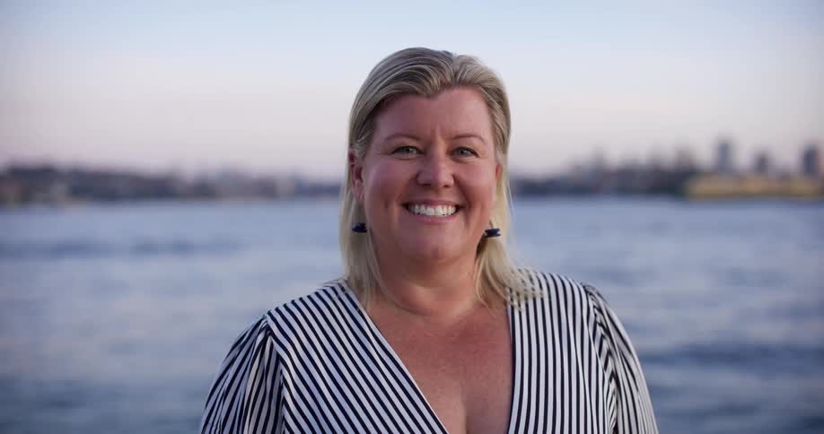Woman smiling by the sea