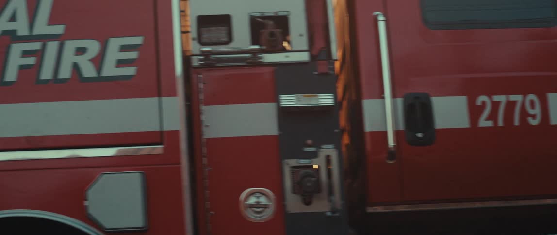A red fire truck passes by