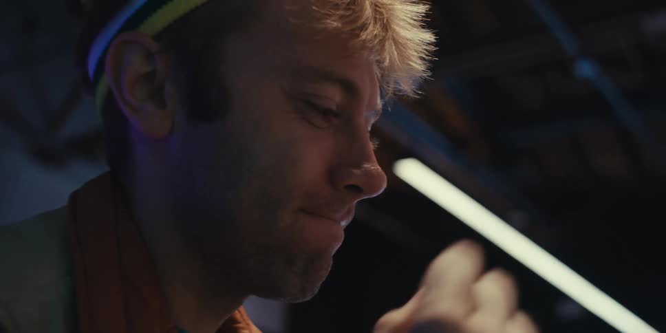 Man getting happy and excited while playing on an arcade machine