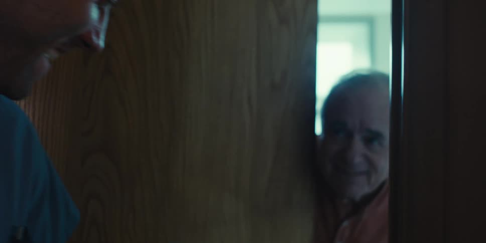 A man is being assisted out of the bathroom
