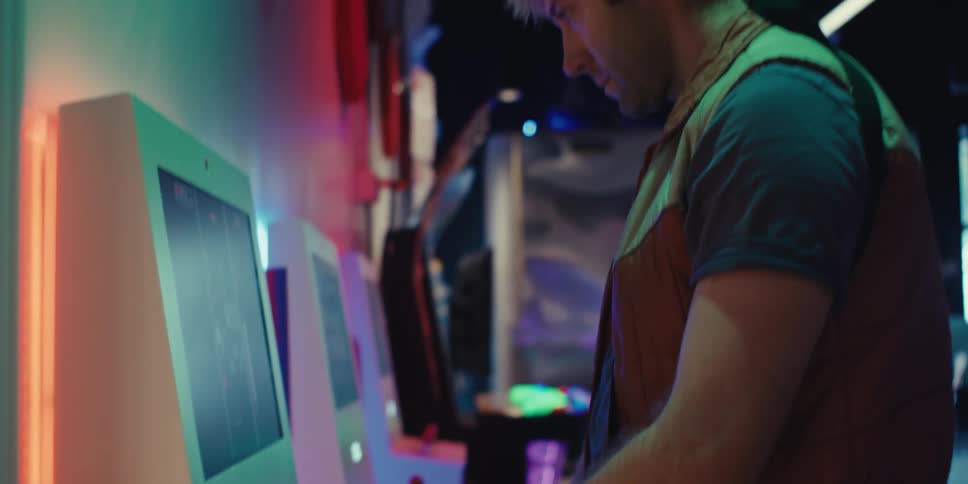 Concentrated man in front of an arcade machine