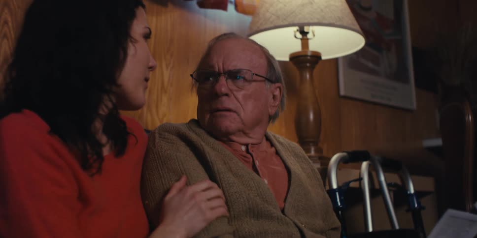 Daughter talking to her elderly father who is a little stressed