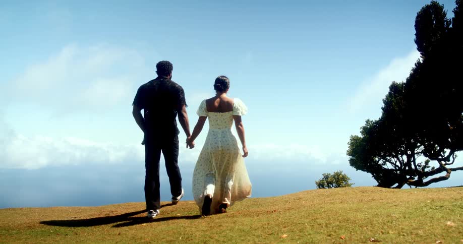 A clip of a man and woman holding hands