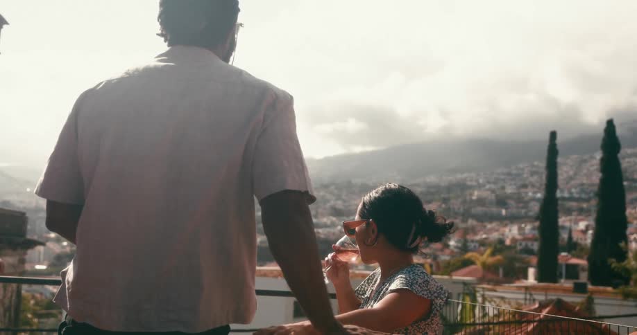 Man and woman on high ground having a drink