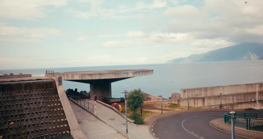 Highway along the ocean with mountains on the horizon