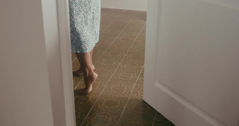 Womans feet on tiptoe against a floor