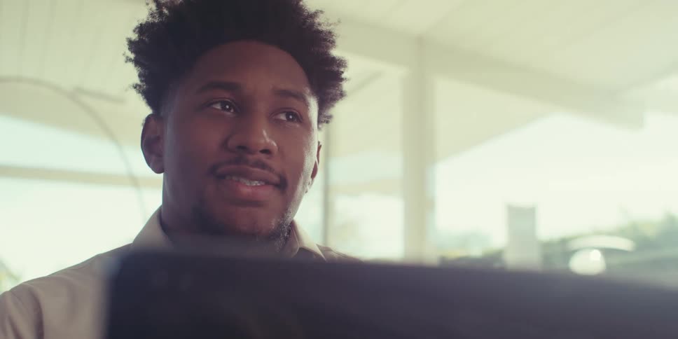 Portrait of a man happily talking in an indoor space