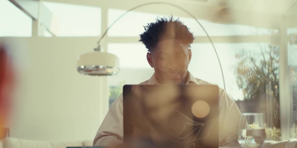 A clip of a person having a conversation on a laptop