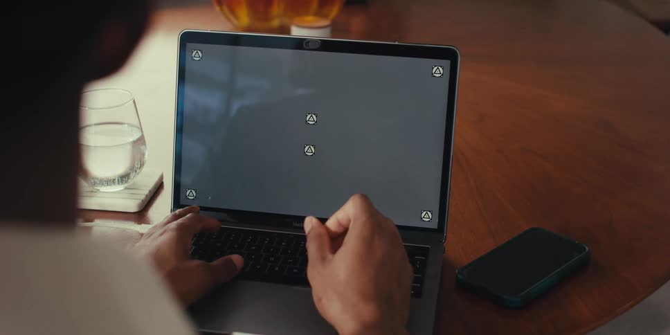Pair of hands typing on a laptop