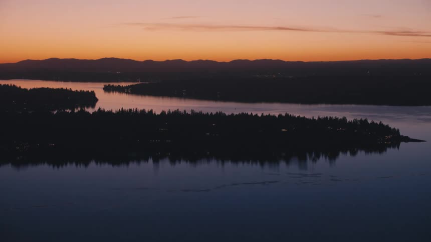 Aerial landscape of a winding river with forested banks