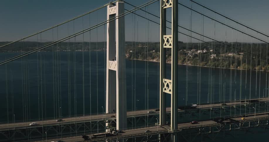 Two large bridges above sea level with reverse vehicle traffic
