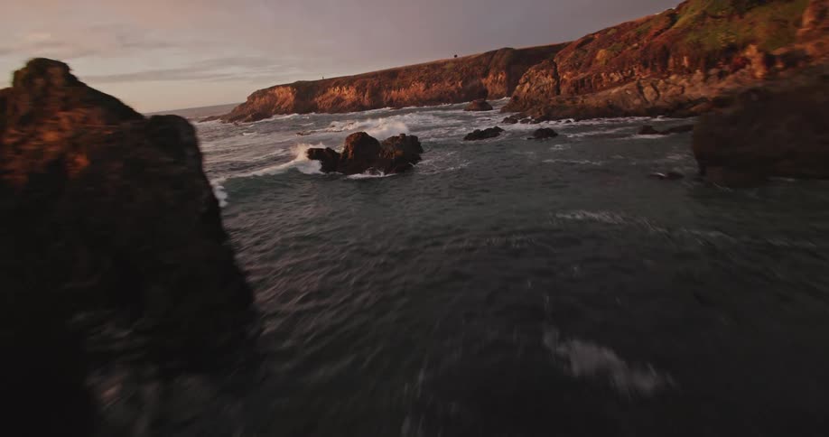 Aerial landscape of an ocean at the edge of a rocky coast