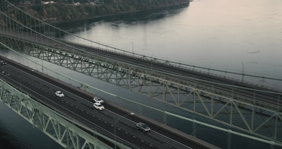 Vehicles crossing a bridge over the sea