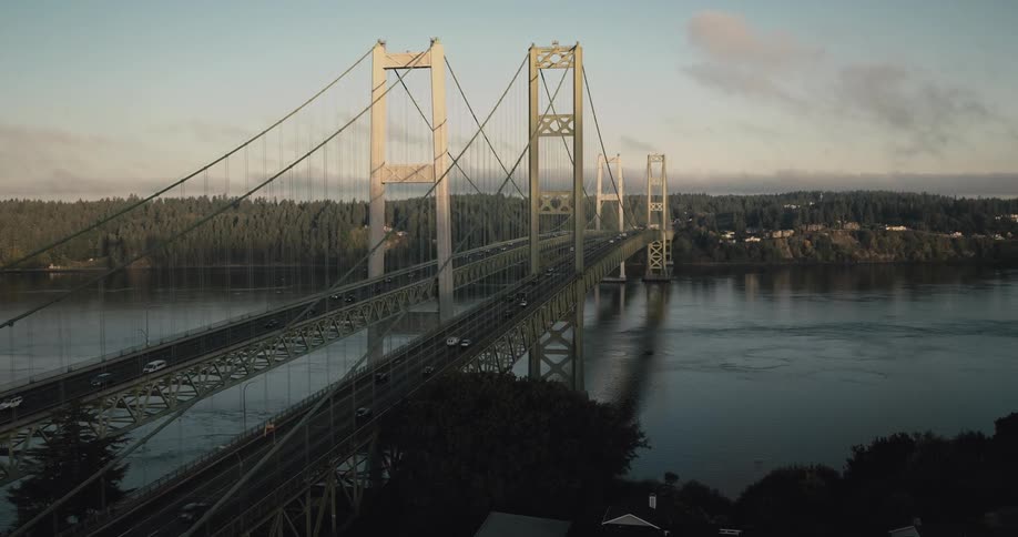 Aerial view of two large bridges spanning a sea canal
