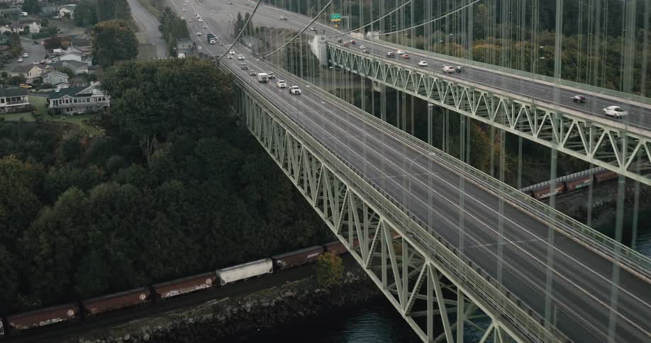 Aerial view of two large bridges with traffic flow during the day
