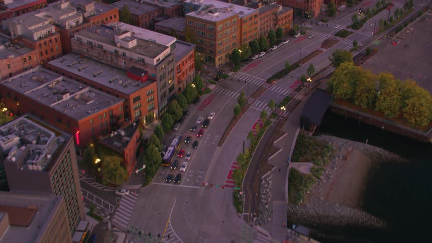 Aerial panorama of an urban city with highways and vehicle traffic