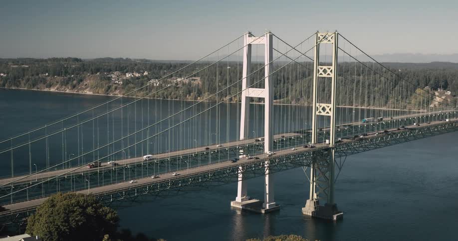 Aerial view of a large imposing bridge over the sea with vehicle traffic
