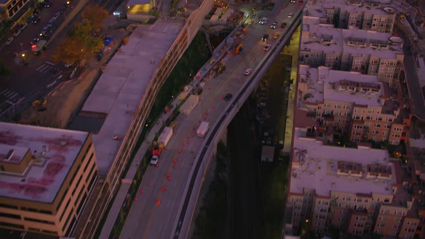 Aerial view of intersections with vehicle traffic crossing an urban city