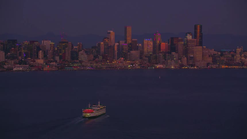 Scene of an isolated ship traveling at sea and in the background a metropolis with modern skyscrapers