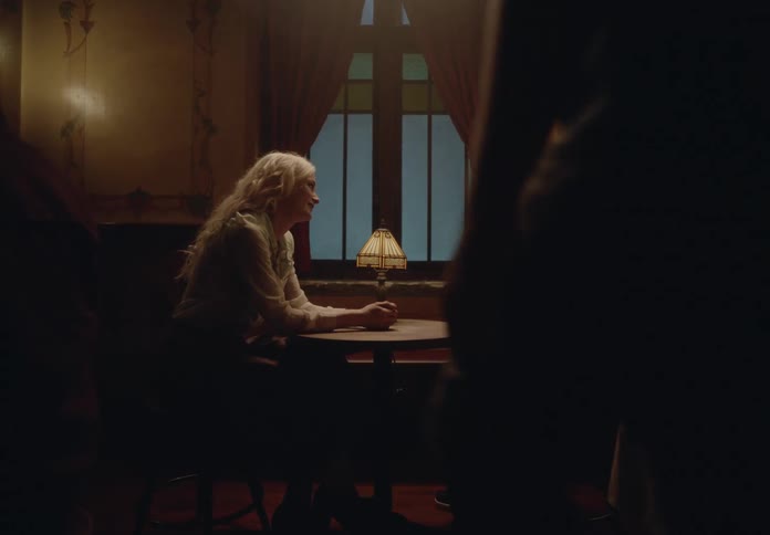 Man sitting at a restaurant table with a woman